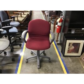 Red padded grey frame adjustable height desk chair on castors 2/15/24