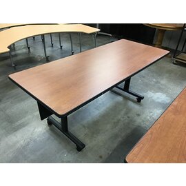 30x72x29” Light cherry color laminate table on castors 3/15/24