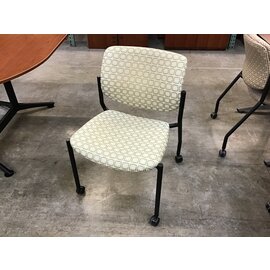 White tan patterned stackable chair on castors 3/15/24
