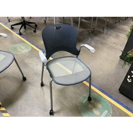 Blue stackable plastic back grey mesh seat Herman Miller chair on castors 7/10/26