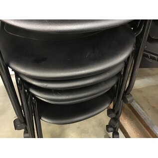Black plastic left hand tablet arm chair on castors - some light scuffs throughout 6/12/25