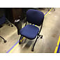 Navy blue padded right hand tablet arm chair on castors 4/28/25