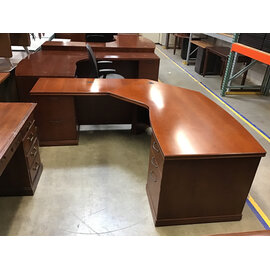 78x80” Curved L shaped light cherry color desk. 33” deep 29” tall. 5 drawers left return - some scuffs 11/7/25