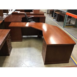 78x80” Curved L shaped light cherry color desk. 33” deep 29” tall. 5 drawers left return - some scuffs 11/7/25