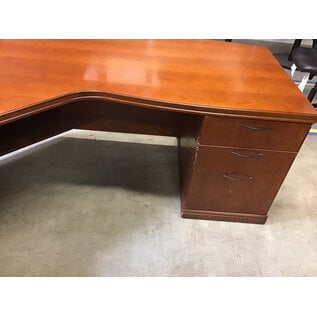78x80” Curved L shaped light cherry color desk. 33” deep 29” tall. 5 drawers left return - some scuffs 11/7/25