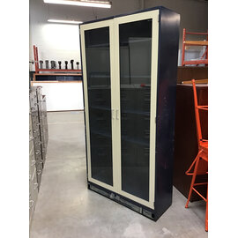 16x42x85” Blue metal lab cabinet with glass doors. Height adjustable leveling feet and adjustable shelves 12/15/25
