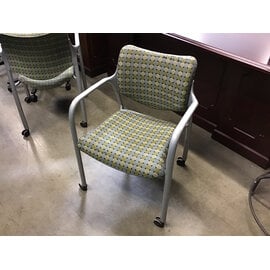 Green/teal pattern cushioned metal frame side chair on castors - some scuffs 1/5/26
