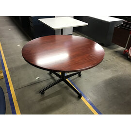 48” Cherry color round table on castors - some wear 3/5/26