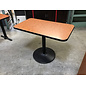 24x42” Brown laminate top black metal pedestal table - some wear throughout 6/8/26