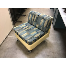 27 1/2” Wide blue and tan pattern cushioned seat sectional piece on castors - some wear and staining throughout 9/25/26