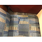 27 1/2” Wide blue and tan pattern cushioned seat sectional piece on castors - some wear and staining throughout 9/25/26