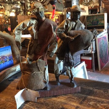 Papier-mache figures on stand