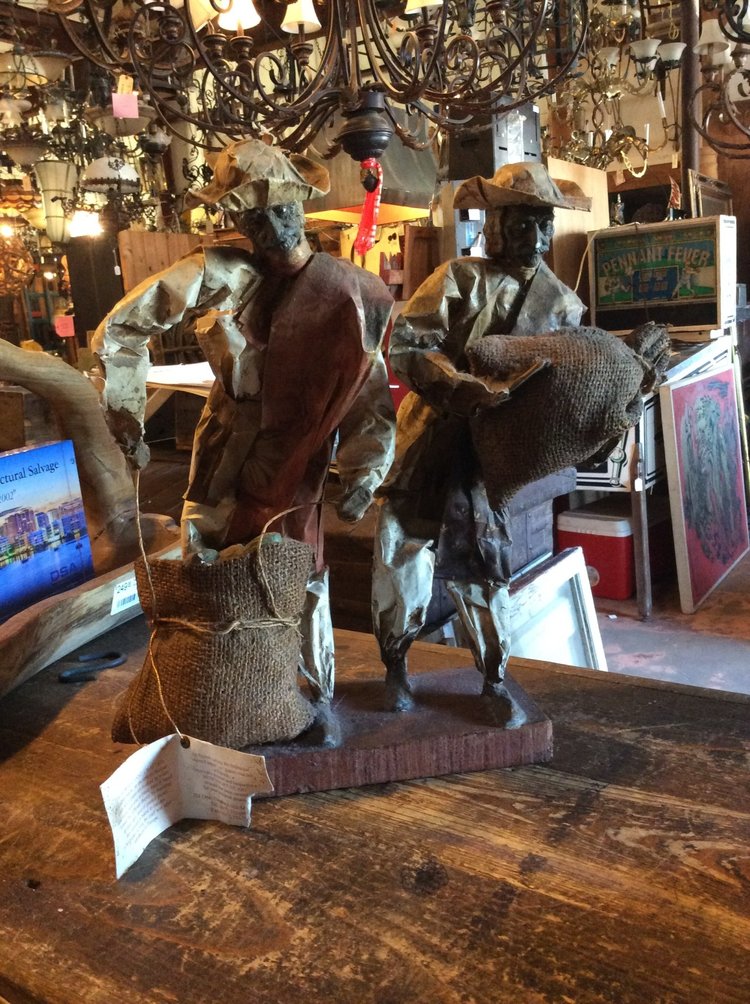 Papier-mache figures on stand