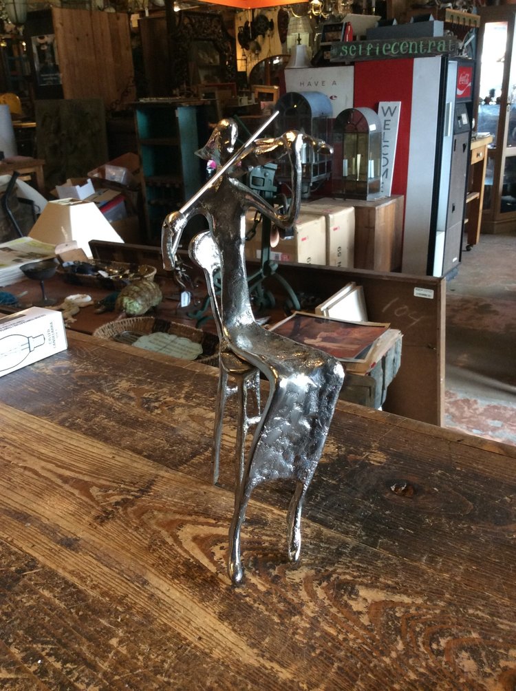 Aluminum figure playing violin