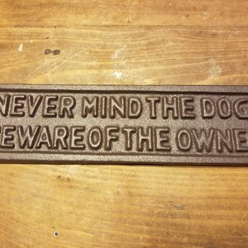 Never Mind The Dog Iron Plaque