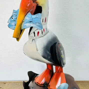 Pelican on Rocks 20" H x 14" L x 10" W