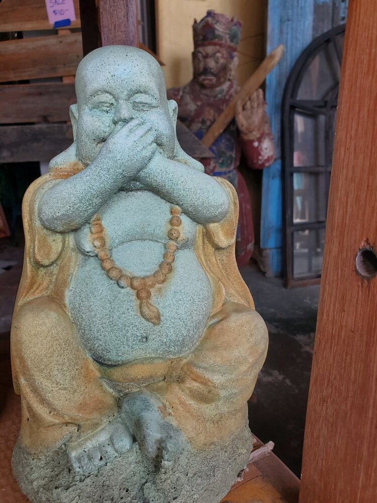 Monk hand over mouth