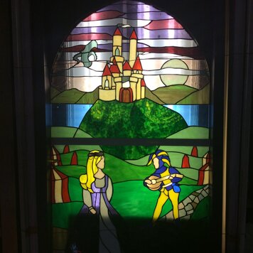 Stained glass jester and princess