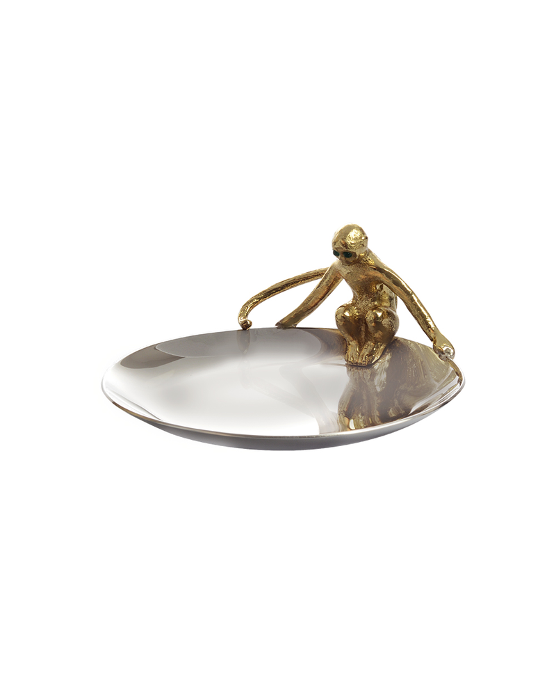 Michael Aram Michael Aram was inspired by themes from the Chinese "Year of the Monkey" and its Earthly element of metal, in the creation of the Monkey Dish. Embodied in a hand-sculpted, polished brass monkey set with jade eyes, this piece captures the playfulness for