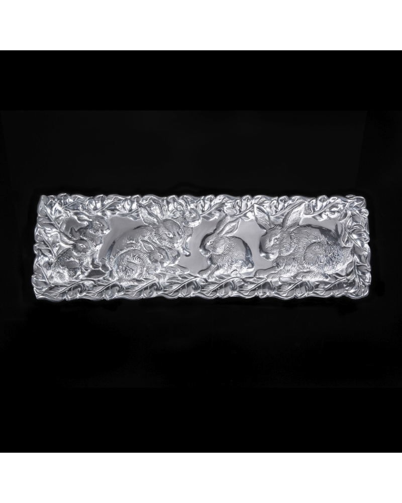Arthur Court Designs Bunny Oblong Tray<br />
A group of rabbits band together in the middle of this tray as the dense forest surrounds them. Our craftsmen capture incredible detail within the bunnies' fur and the framing foliage in this handmade, aluminum design.