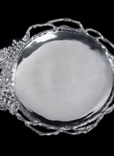 Arthur Court Designs Grape Vine Round Tray<br />
Twisting, openwork vines transition into a detailed collection of grapes and leaves on the edge of this handmade, aluminum dish. The lines defining the shape of the fruit and the marks in the vegetation form a textured border around
