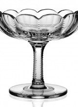 The Inez design is very stylish with small cuts on the sides of the sweeping shapes. The flower vases and the small comport have scalloped edges, making these pieces simple yet dramatic.