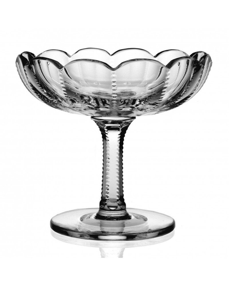 The Inez design is very stylish with small cuts on the sides of the sweeping shapes. The flower vases and the small comport have scalloped edges, making these pieces simple yet dramatic.