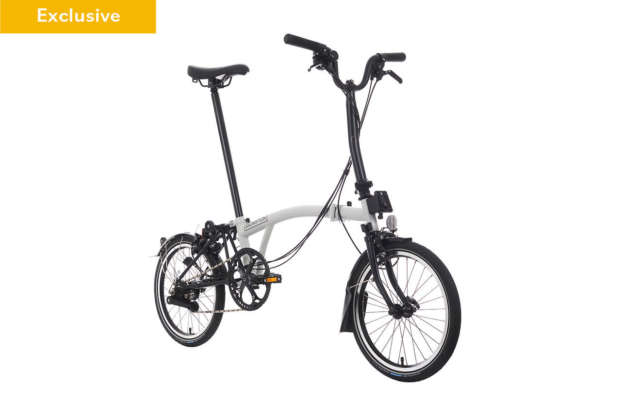 Brompton Bike C Line Explore Papyrus White Black Edition Mid rise handlebar Extended Seatpost Brompton Saddle The Bike Center