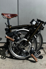 Brompton Brompton - Bike - C Line 6-speed, Mid-rise HB, Std SP, Brooks B17s Special Brown, Ergon GP1-S BioKork Grips, Dynamo lighting, Rear Rack, Black Lacquer w/Chrome Parts