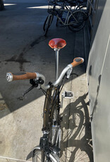 Brompton Brompton - Bike - C Line 6-speed, Mid-rise HB, Std SP, Brooks B17s Special Brown, Ergon GP1-S BioKork Grips, Dynamo lighting, Rear Rack, Black Lacquer w/Chrome Parts