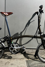 Brompton Brompton - Bike - C Line 6-speed, Mid-rise HB, Std SP, Brooks B17s Special Brown, Ergon GP1-S BioKork Grips, Dynamo lighting, Rear Rack, Black Lacquer w/Chrome Parts