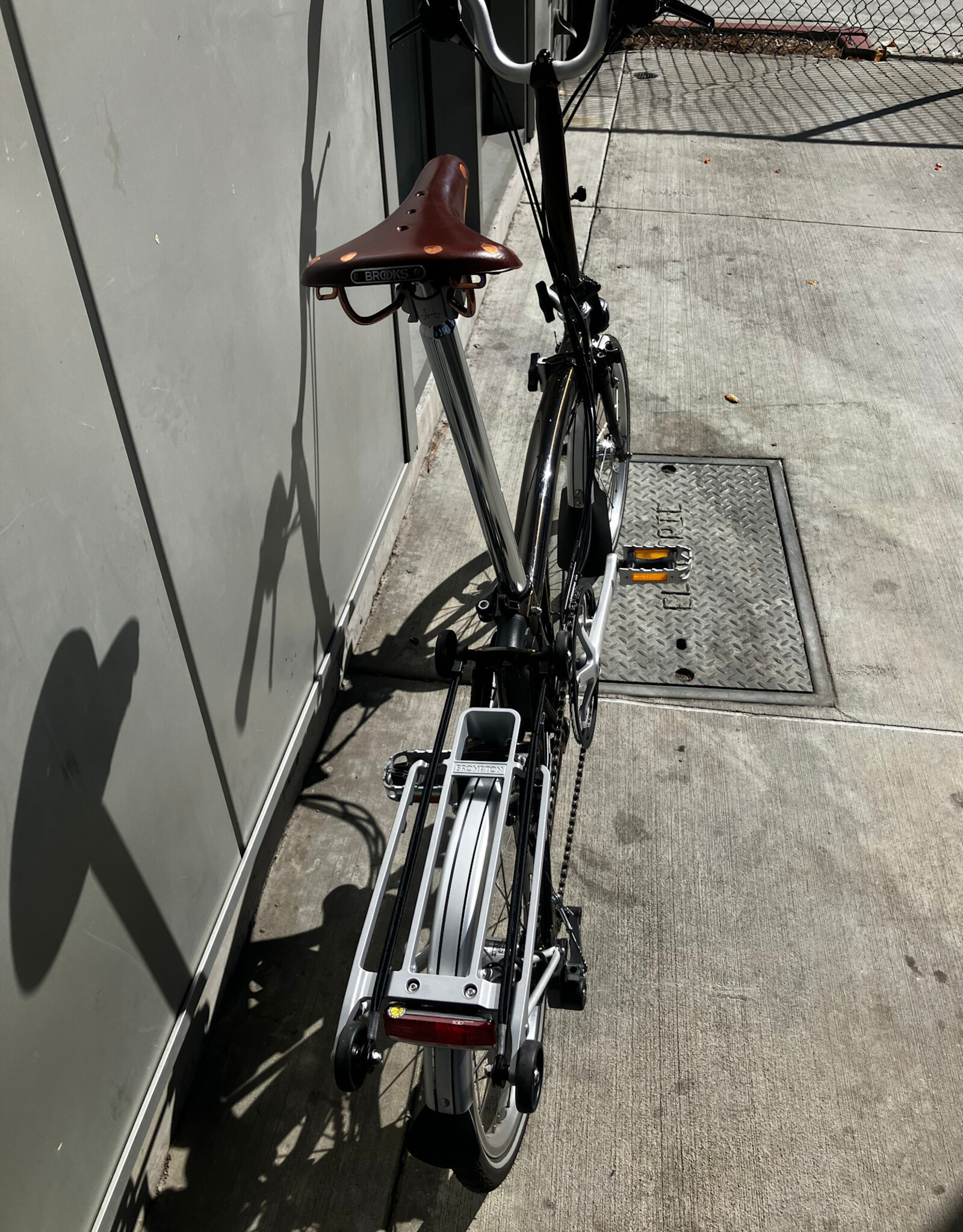 Brompton Brompton - Bike - C Line 6-speed, Mid-rise HB, Std SP, Brooks B17s Special Brown, Ergon GP1-S BioKork Grips, Dynamo lighting, Rear Rack, Black Lacquer w/Chrome Parts