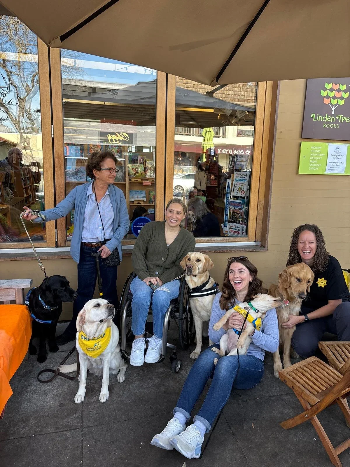 Community members and service dogs gathered outside Linden Tree Books