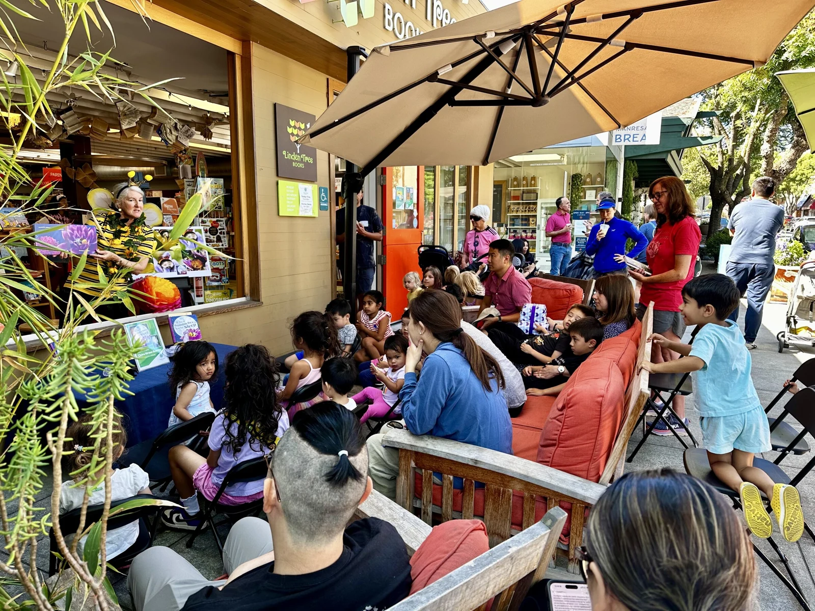 Families enjoying an outdoor storytime at Linden Tree Books