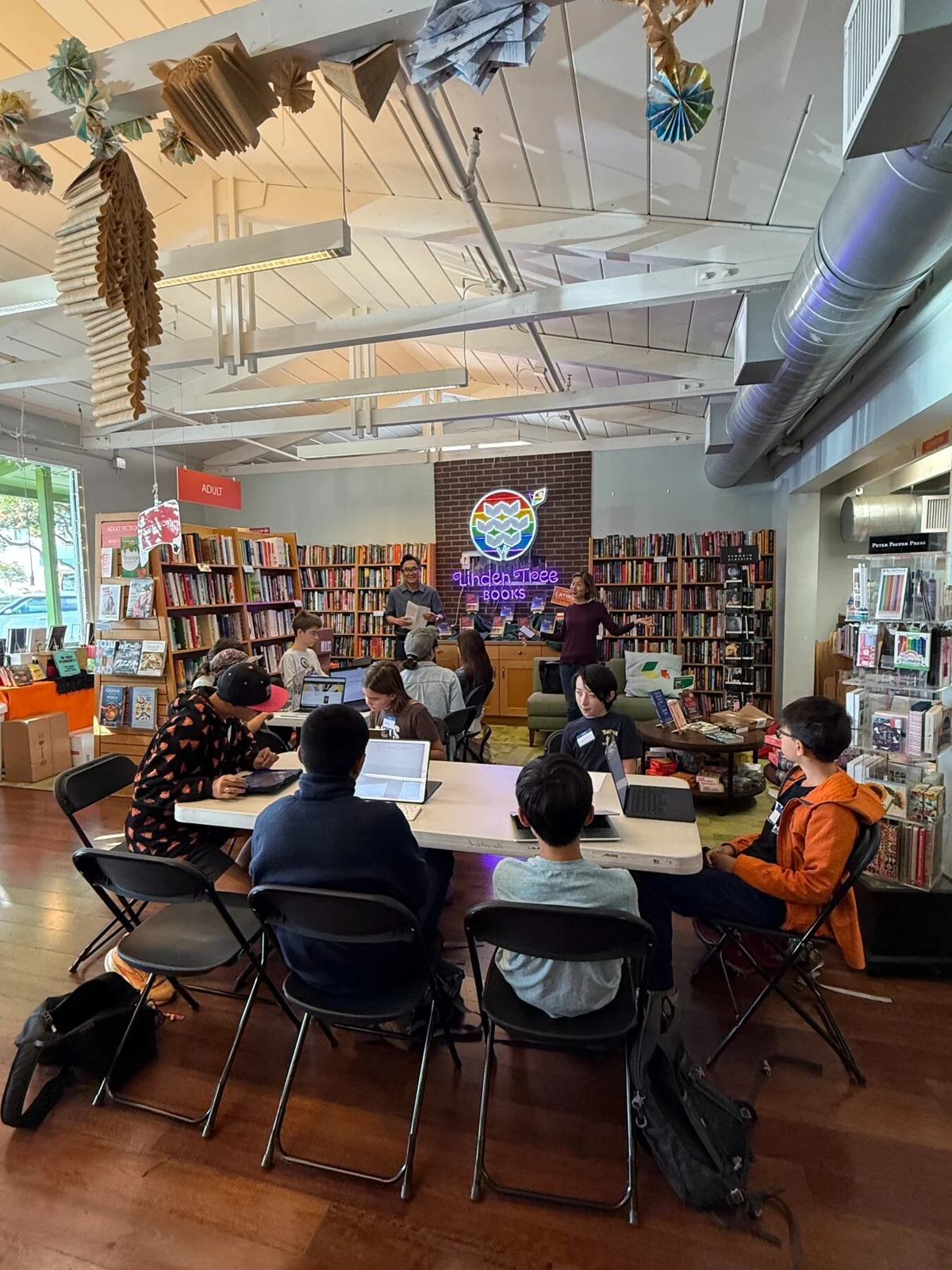 Young writers sharing a table at a Linden Tree writing workshop