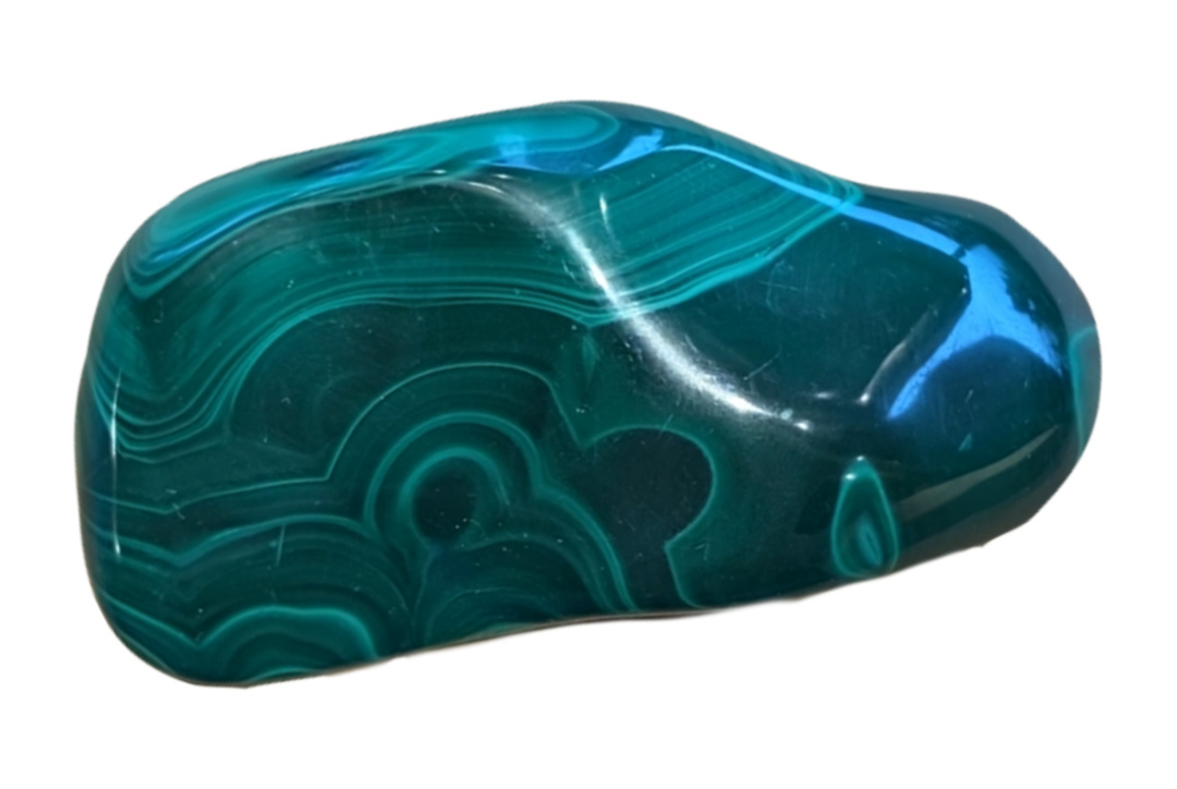Oblong shaped piece of malachite with intricate patterns of waves and circular inclusions