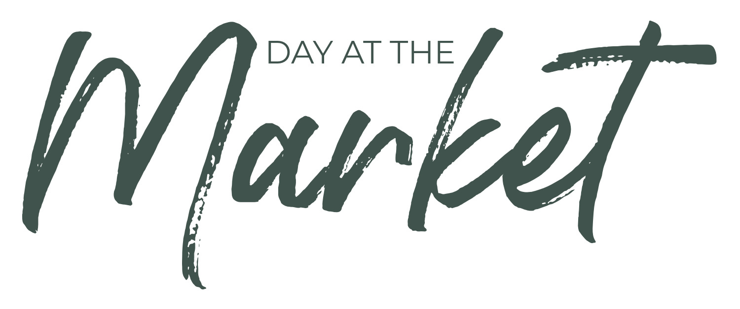 White background with dark green text that reads 'day at the market".