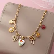 Gold Plated Figaro Chain Multi-Charm Necklace | 80N92748