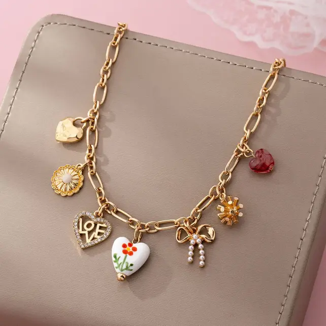 Gold Plated Figaro Chain Multi-Charm Necklace | 80N92748