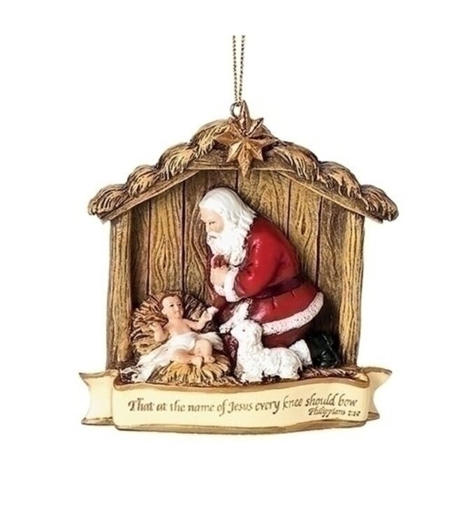 Kneeling Santa in Manger Ornament