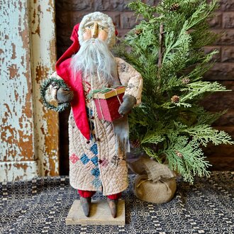 Santa in Quilt Robe Holding Wrapped Present - 24.5"