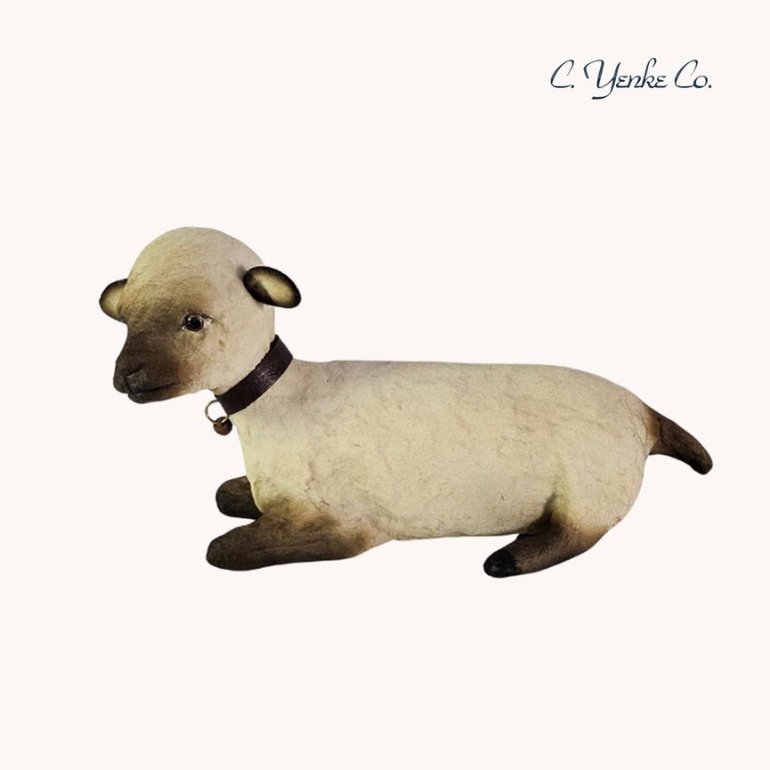 C. Yenke Lamb Figurine Lying Down
