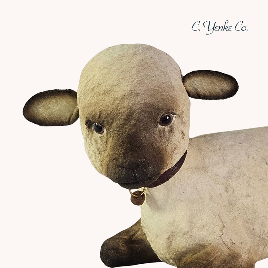 C. Yenke Lamb Figurine Lying Down