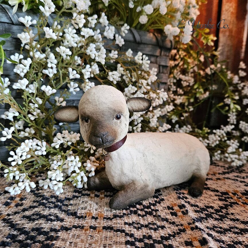 C. Yenke Lamb Figurine Lying Down