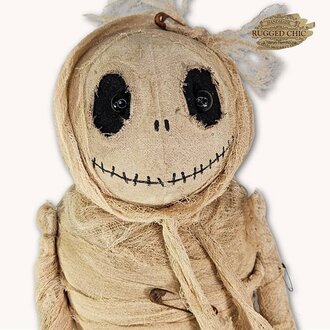 Mummy Doll Holding Pumpkin
