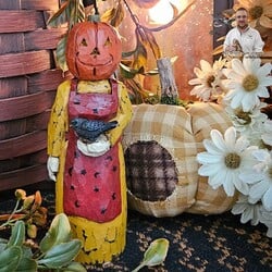 Hand Carved Pumpkin Head Lady Red Apron with Crow - 5"