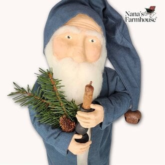 Santa Holding Candle & Greenery