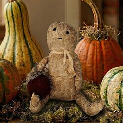 Mummy Sitting with Grungy Cheesecloth & Stitching Holding Pumpkin - 8"