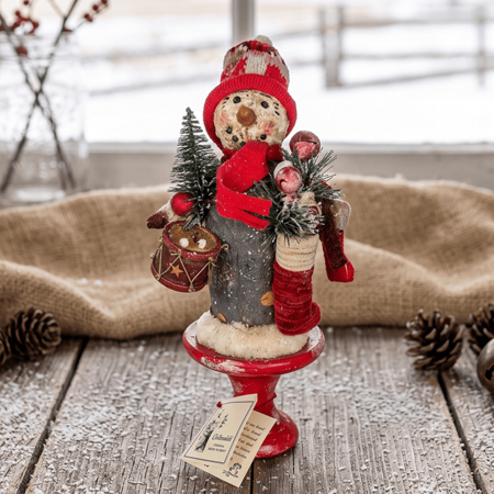 Snowman on Pedestal with Vintage Toys