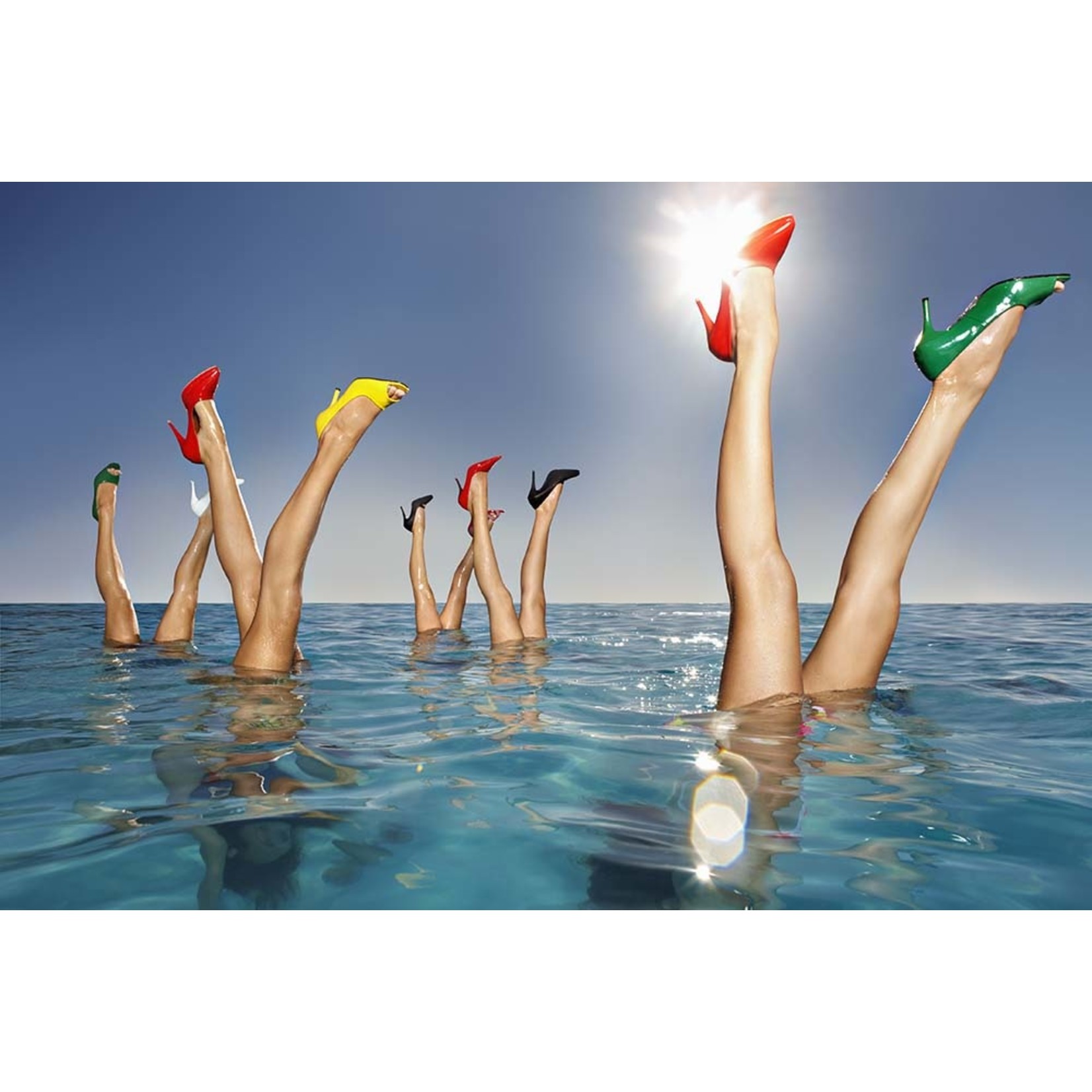 Getty Images Gallery Group of legs portruding out of infinity pool by Karan Kapoor via Getty Images Gallery